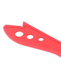 Close-up view of Workhorse Woodworking Safety Push Stick, red plastic with ergonomic design, ideal for guiding wood safely.
