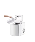 Top Shelf Compact Ice Maker For Countertops Kickin Out Twenty Six Pounds Each Day In Record Time With A Sleek White Finish pouring water.