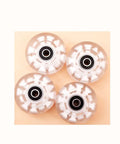 Top view of Light Up 58mm x 32mm Roller Skate Wheels with Bearings for Quad Skates and Outdoor Double Row Skating White 8 Pack 82A PU