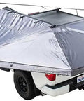 Nomadic 270 Awning With Lights And Blackout Fabric Driver Side Gray Hex With Black Trim And Travel Cover on a vehicle