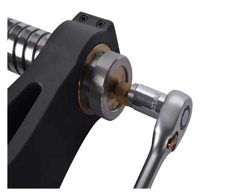Close-up of digital Brinell hardness tester impact pin hammer durometer for precise readings on steel and cast iron.