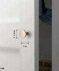 Champagne Bronze Kitchen Cabinet Knobs 6 Pack Round Modern Hardware For Cabinets And Dressers One And One Eighth Inch Diameter Fingerprint Resistant Brushed Finish Easy Install Chic Minimalist Look For Any Room. Shown installed on white cabinet with size measurements, featuring champagne bronze finish.