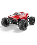Red Volcano One Sixteenth Scale RC Monster Truck With Four Wheel Drive and LED headlights, off-road tires visible.