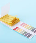 80 Strips Pack PH Tester Strips Full Range 1 to 14 Litmus Paper with color chart, product laying open on blue background