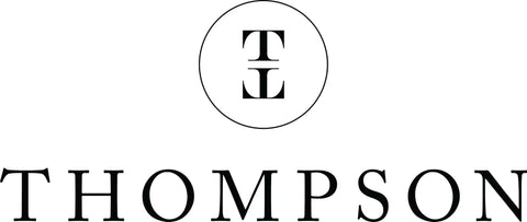 Thompson logo with a black circular design featuring the letters T and L. Elegant typography for branding.