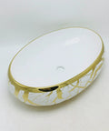 Sleek Gold Ceramic Vessel Sink Oval Bathroom Basin With Luxe Shine For Quick Vanity Upgrades Smooth Daily Routines And Fast Room Makeovers Turn Your Wash Setup Into A Total Flex white interior with gold leaf accents