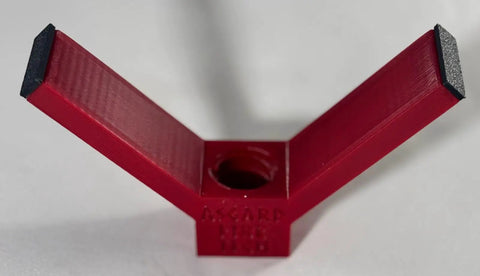 Close-up of Rock Solid Dual Magnet Smoke Detector Test Tool For Fire Safety Systems, red plastic with dual magnetic probes.