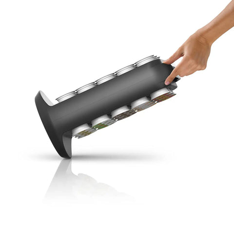 Hand tilting black 30 Pod Capacity Single Serve Coffee Pod Storage, Countertop Carousel Organizer In Black showing side view