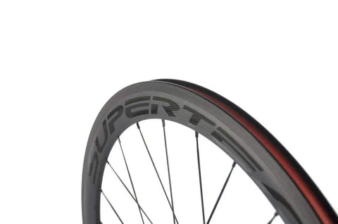 Close-up of 50mm 23mm Carbon Road Wheelset 700c Clincher for Aero Performance, showing sleek matte 3K braking surface, V brake ready