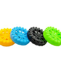 Four colorful plastic toy wheels from 40 Pack Plastic Toy Wheels With 2mm Shafts And 20 Metal Axles For RC Cars Boats Drones