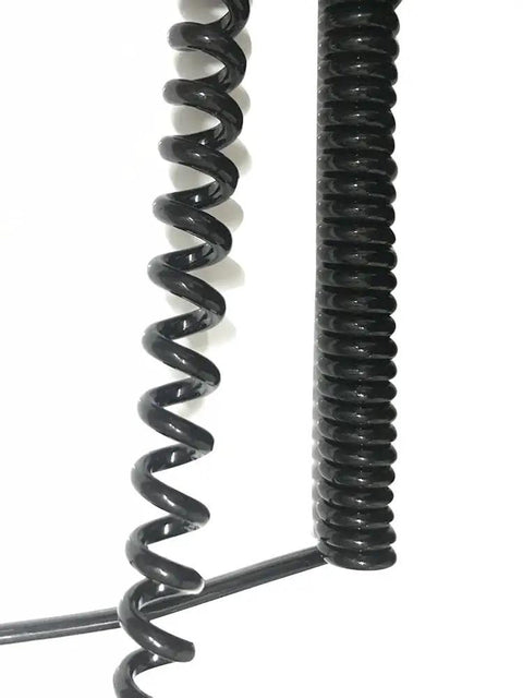 Heavy Duty Six Core Coiled Extension Cord With Spiral Spring Retraction For Mobile Equipment And Fixed Setups showing coiled black cables.
