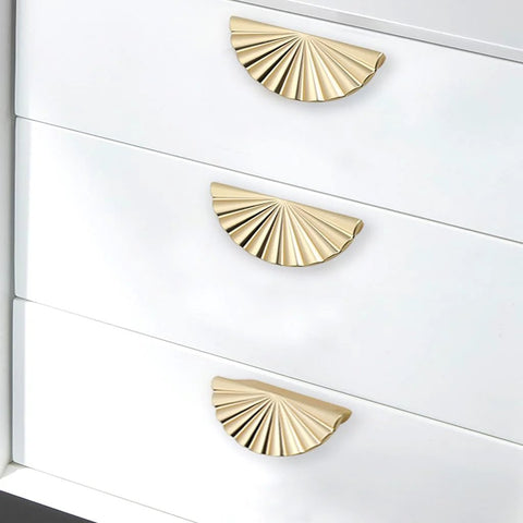 Semicircle Sunflower Cabinet Pulls In Brushed Gold Finish 6 Pack Durable Zinc Alloy Drawer Handles Knobs For Kitchen And Bathroom Cabinets Half Round Design With Screws Finger Edge Pulls 2.5 Inch Hole Center Elegant Warm High Quality installed on white cabinet.