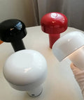 Red, black, and white Cordless USB Rechargeable Desk Lamp With Touch Dimming, Mushroom Night Light displayed on a table.
