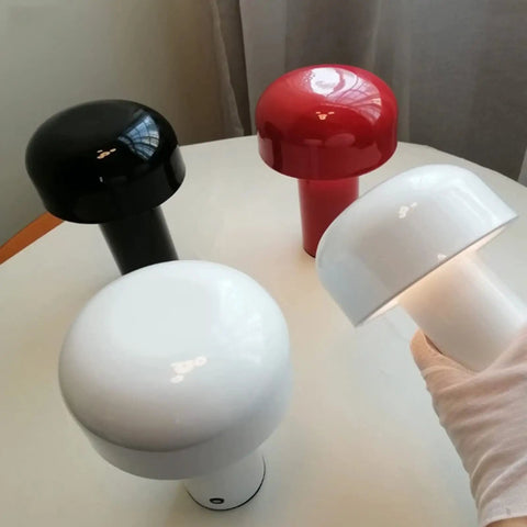 Red, black, and white Cordless USB Rechargeable Desk Lamp With Touch Dimming, Mushroom Night Light displayed on a table.