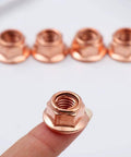 Heavy Duty 12 Pack M8 Hex Nuts For Exhaust Manifold Copper Flashed Engine Hardware High Heat Resistant Fastener Kit image showing a single nut held on a finger