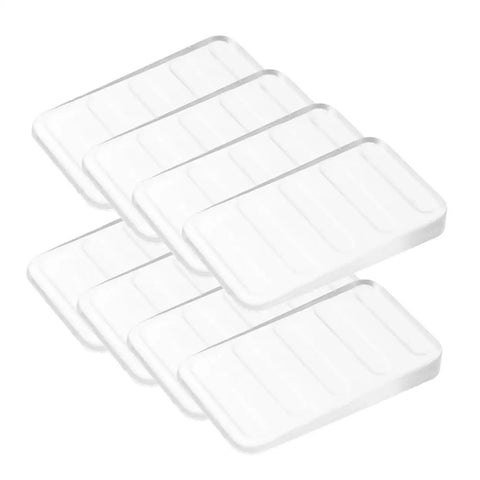 Clear Plastic Leveling Shims For Furniture Wobble Fix 32 Piece Wedge Set stacked to stabilize furniture on uneven floors.