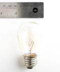 Ruler next to a single S14 bulb from Beefed-Up 100 Foot Outdoor Commercial String Lights With E26 Suspended Sockets, Weatherproof Vintage Exterior Lighting, 50 S14 11W Bulbs, 100 Ft Run For Patio And Backyard Parties, Built To Last.