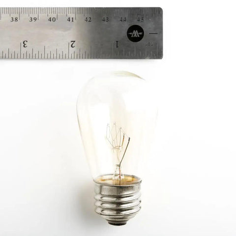 Ruler next to a single S14 bulb from Beefed-Up 100 Foot Outdoor Commercial String Lights With E26 Suspended Sockets, Weatherproof Vintage Exterior Lighting, 50 S14 11W Bulbs, 100 Ft Run For Patio And Backyard Parties, Built To Last.