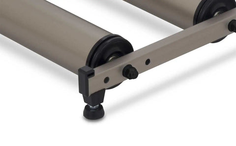 Detail of G2 Folding Bike Trainer with Step Guard and alloy rollers ultra quiet operation, showing adjustable rear roller fit.