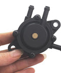 3 Port Vacuum Fuel Pump For Small Engine Lawn Mower And Tractor, Universal Replacement With Durable Black Plastic Body in hand