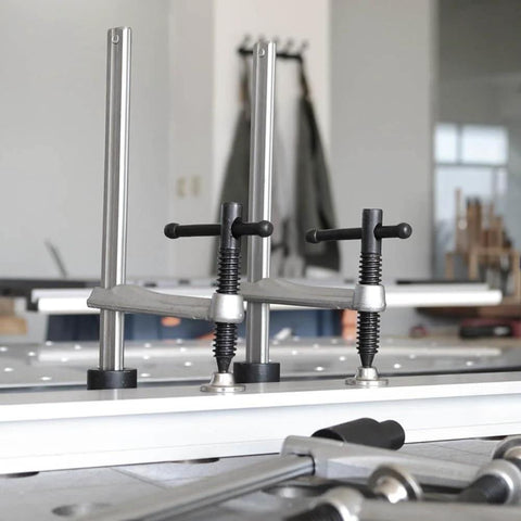 Quick Acting Desktop Hold Down Clamp for Woodworking Benches and Tables, Handy Workholding Clip on a bench with 16mm and 28mm holes.