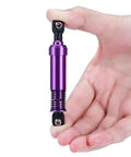 Person holding a purple aluminum shock absorber showing the design for Beefy 4Pc Aluminum Big Bore Shocks 95mm For 1/10 RC Crawler Builds LCG Chassis.