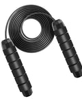 Black adjustable jump rope for fitness with smooth ball bearings, PVC-coated, shown coiled with ergonomic handles for cardio workouts.