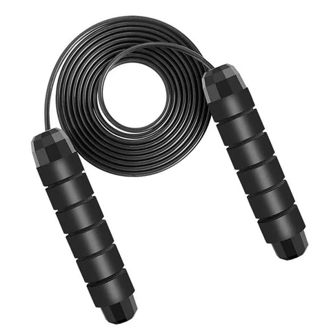 Black adjustable jump rope for fitness with smooth ball bearings, PVC-coated, shown coiled with ergonomic handles for cardio workouts.