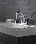 Woodhurst Centerset Chrome Two-Handle Bathroom Faucet for modern sinks with push-pop drain assembly shown installed