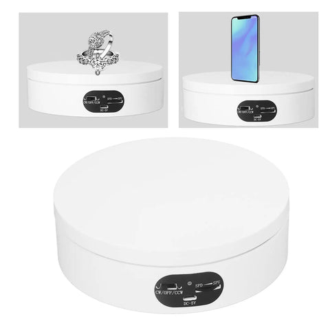 Motorized 360 Degree Rotating Turntable Stand For Jewelry Photography displaying ring and smartphone on white base.
