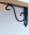 Built Tough Metal Angle Brackets For Wall Shelves Solid L Shape Corner Supports With All Included Hardware No Sweat Assembly Matte Black Triangle Shelf Mounts Set Of Two, highlighting metal design on wall.