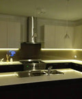 Modern kitchen with LED strip lighting controlled by Mini PIR Motion Sensor Switch For DIY LED Lighting, Occupancy Sensor, DC 12V To 24V.