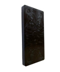Hella Tough Quarter Inch Black Plastic Flat Plate Shim standing vertically, essential for cabinet leveling and tile spacing.