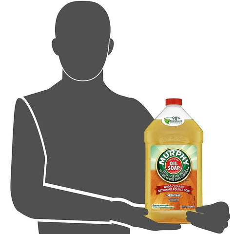 Original Wood Cleaner Liquid That Safely Cleans All Wood Surfaces And Brings Out Their Natural Beauty With No Ammonia Or Bleach Added Trusted For Over A Hundred Years In A Thirty Two Ounce Bottle shown with silhouette holding bottle.