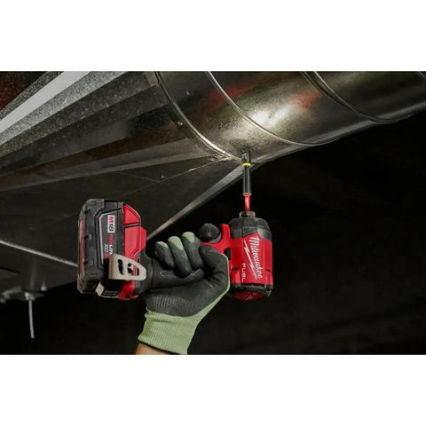 Hand holding a drill fitted with Shockwave 3/4 Inch Drive Impact Duty Socket With Ball Detent And Dual Hole Groove on metal duct.