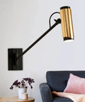 Adjustable Swing Arm Wall Lamp Heavy Duty Metal Bedside Light Modern E14 Wall Sconce with gold accent beside a modern sofa.