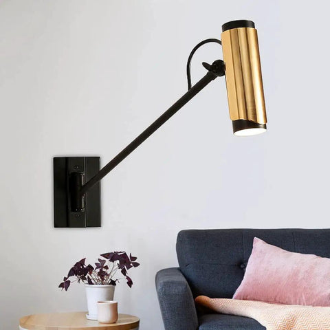 Adjustable Swing Arm Wall Lamp Heavy Duty Metal Bedside Light Modern E14 Wall Sconce with gold accent beside a modern sofa.