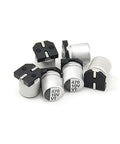 Close-up of 470uF aluminum capacitors from 200 Piece SMD Aluminum Electrolytic Capacitor Kit With Ten Values from 1U to 470U in durable box.