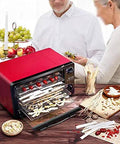 Digital Food Dehydrator With Stackable Trays And Adjustable Heat Timer For Fruit Vegetables And Pet Snacks Electric Drying Machine on kitchen countertop with dehydrating fruits.