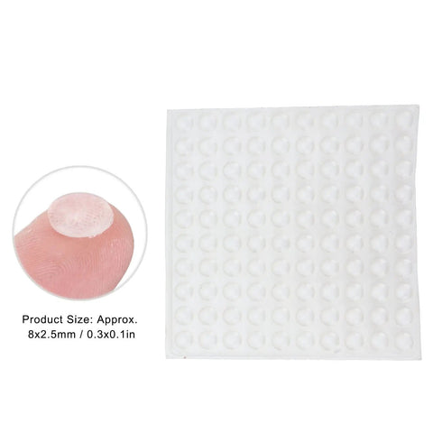 Sheet of Self Adhesive No Slip Transparent Rubber Buffer Pads For Tables, Chairs, Photo Frames And Furniture, close-up on finger.