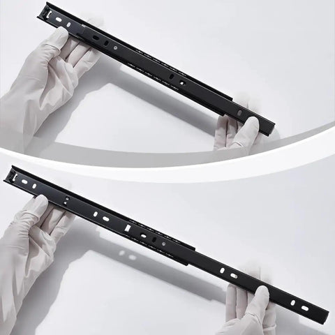 Four Piece Shop Grade Heavy Duty Steel Soft Close Drawer Slides 11 Inch Full Extension Side Mount Rails held in gloved hand for kitchens.