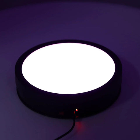 Huge 360 Degree Electric Rotating Turntable Stand With Remote Control And Adjustable Speed Plus Colorful LED Lighting For Pro Product Photography Videos And Live Streams Using USB Power on dark surface