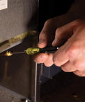 HVAC Multi Bit Pocket Screwdriver 3in1 with Phillips Slotted and Schrader Bits being used by technician