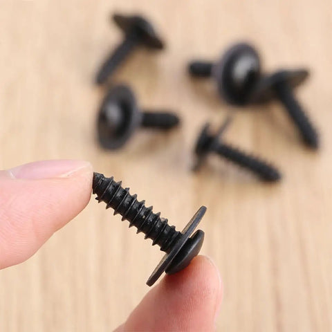 Close-up of Hardcore 40 Pack M4.8 X 17.8 Mm Phillips Truss Head Self Tapping Screws Black Coated Steel Fasteners in hand.