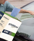 Person using Blue V40 Value Series Center Pull Wiper Sheets All Purpose Disposable Cleaning Towels 10 X 11.5 Inches Roll Of 200