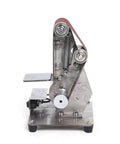 Hella Smooth Dual Bearing Mini Bench Belt Sander Including Ten Premium Sanding Belts For Polishing Grinding And Workshop Professional Tool Sharpening At Variable Speeds, front view showing steel structure and sanding belt.