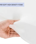 Close-up of hand pressing super soft high-density foam in Outdoor Bistro Chair Cushions Set Of 2, 15 Inch Round Seat Cushions