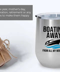 Boating Away 12oz insulated silver wine tumbler for pontoon boats and yachts, shown with gifts, focus on design and lid