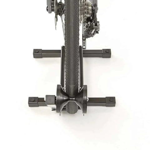 Rakk Bike Storage Rack Freestanding Floor Bicycle Stand for Small Spaces, showing rear wheel support from above