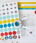 1 Inch Circle Squeeze Punch in white and navy blue on calendar with colored dots for card making and scrapbooking, easy punching